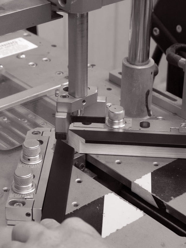 A picture frame moulding being joined at the corners.