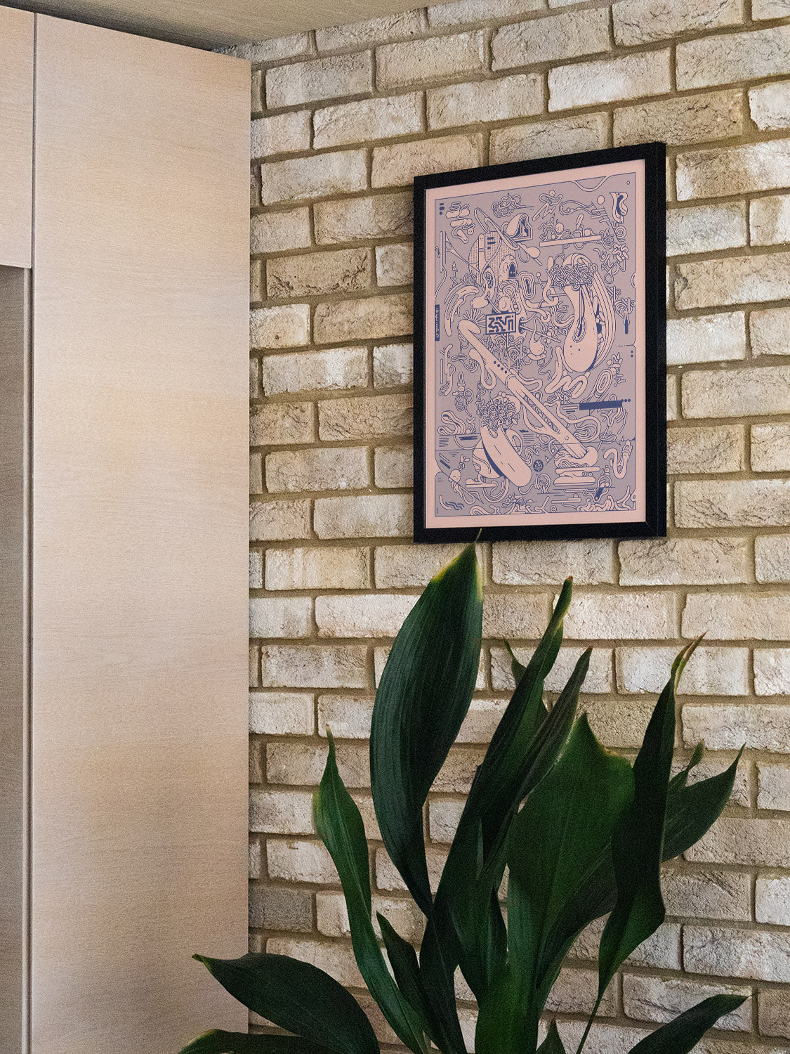 Tatado by Ori Toor displayed in a styled room, set in a sleek black frame. |type=lifestyle|