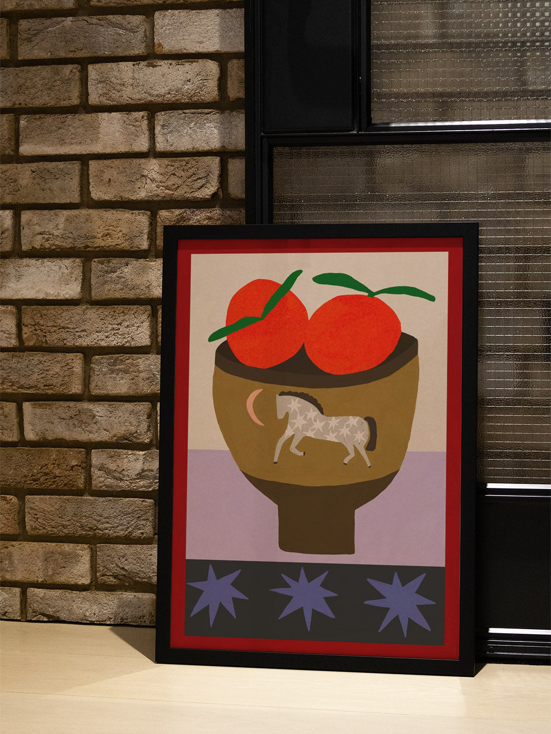 "Oranges In A Vase" by Sophie Deller displayed in a styled interior setting in black frame. |type=lifestyle|