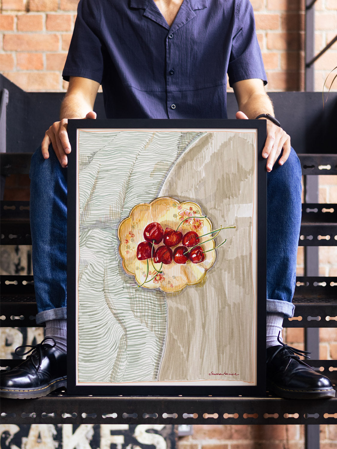 "Cherries" by Emma Louise in black frame; fine art print displayed in a styled modern interior setting. |type=lifestyle|