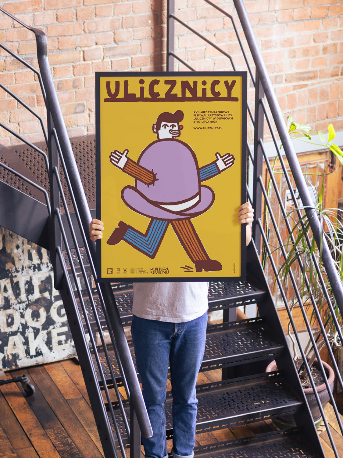 "17th International Street Artists' Festival Ulicznicy" by Bartosz Mamak in black frame displayed in styled interior. |type=lifestyle|