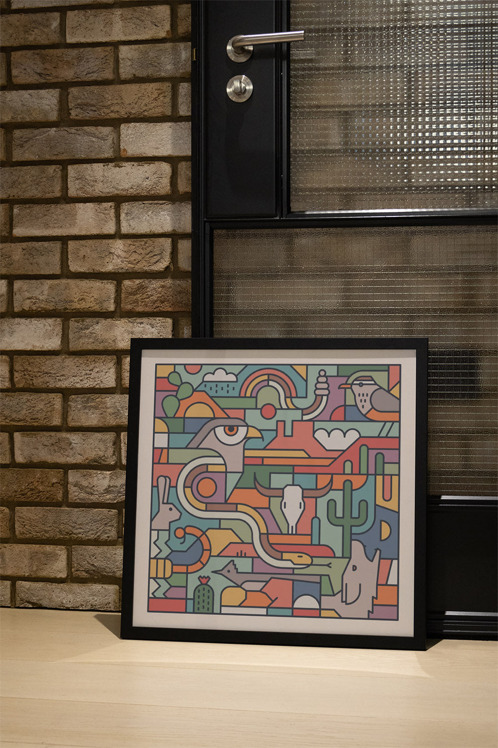 "Desert Study" by Rick Crane in black frame, displayed in a stylish interior setting. |type=lifestyle|