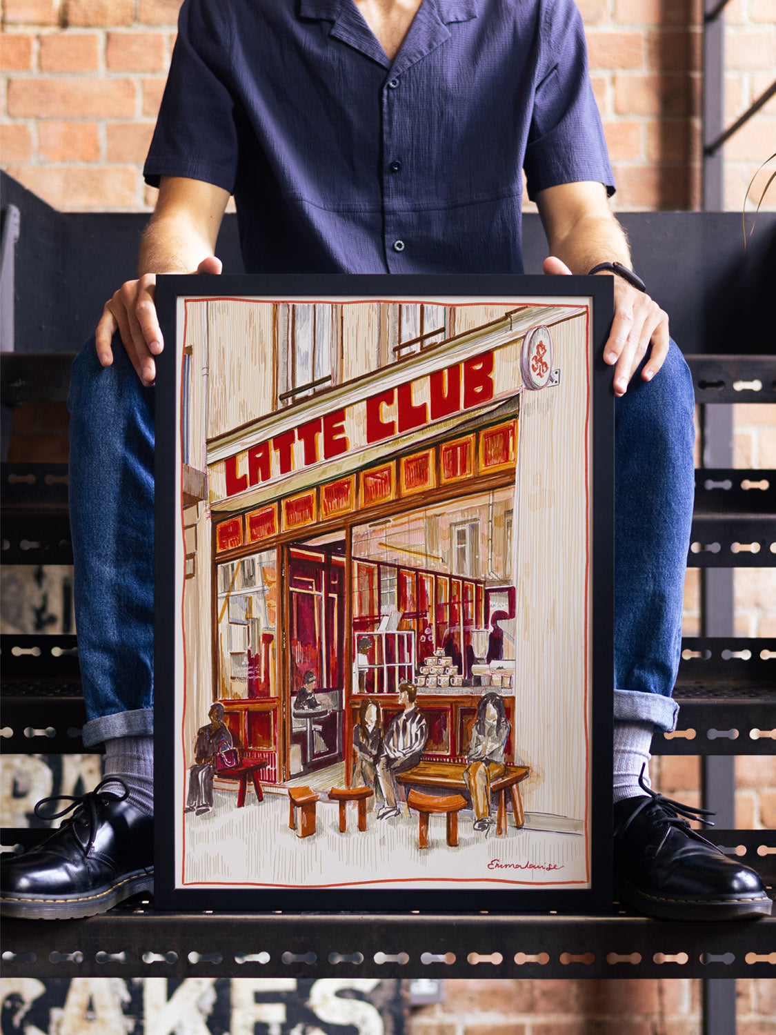 "Latte Club Paris" by Emma Louise displayed in styled room, fine art print in black frame. |type=lifestyle|