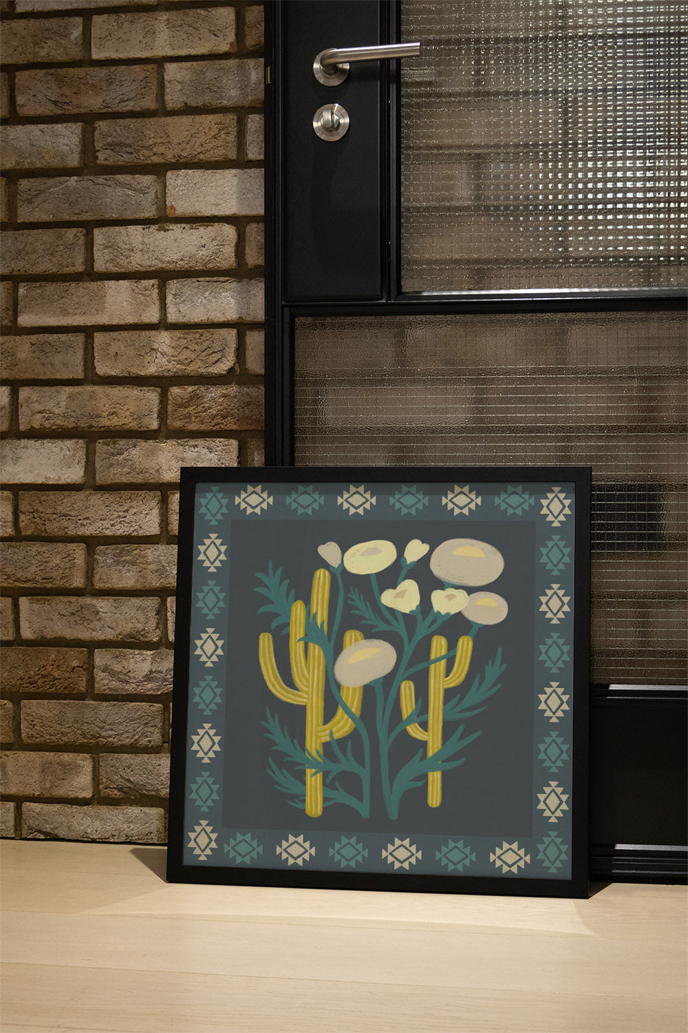 "Cactus Bloom" by Sophia Sky, fine art print in black frame displayed in a styled interior setting. |type=lifestyle|