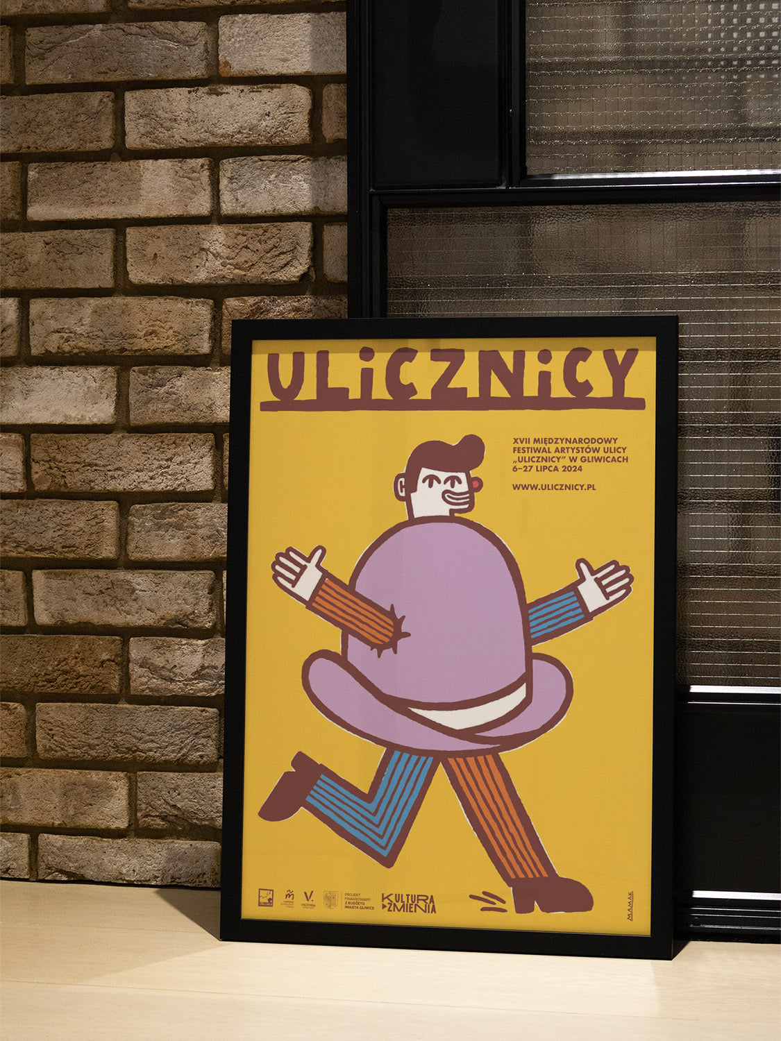 "17th International Street Artists' Festival Ulicznicy by Bartosz Mamak in white frame, displayed in interior." |type=lifestyle|