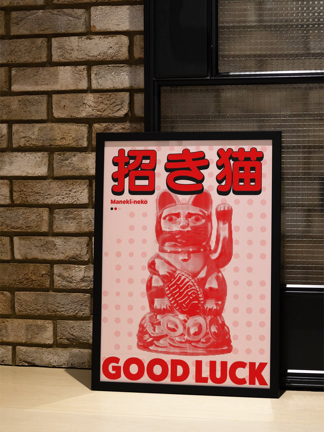 "Maneki-neko by Fifth Layer in black frame displayed in styled interior" |type=lifestyle|