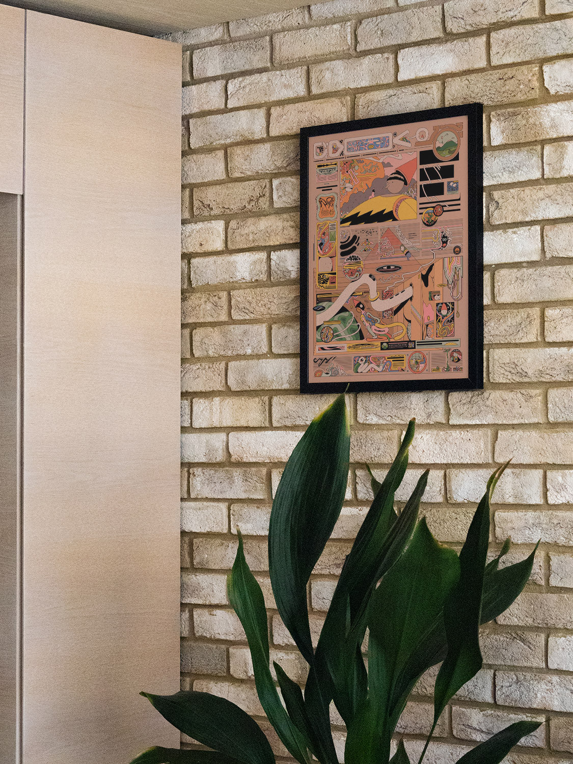 "Magazhieb by Ori Toor displayed in a styled room, in black frame, vibrant colors and abstract forms enhancing the decor."