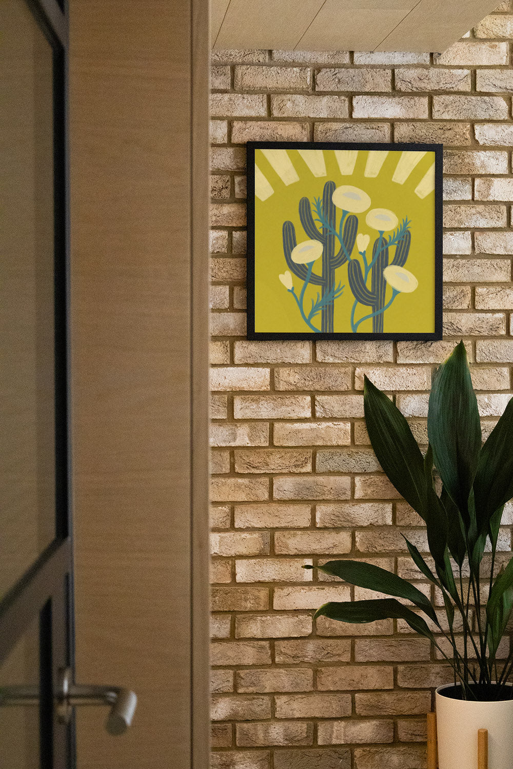 "Sunrise Cactai" by Sophia Sky, fine art print in white frame, displayed in stylish interior setting. |type=lifestyle|