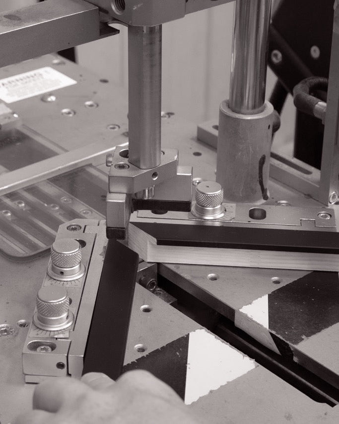 A picture frame moulding being joined at the corners.