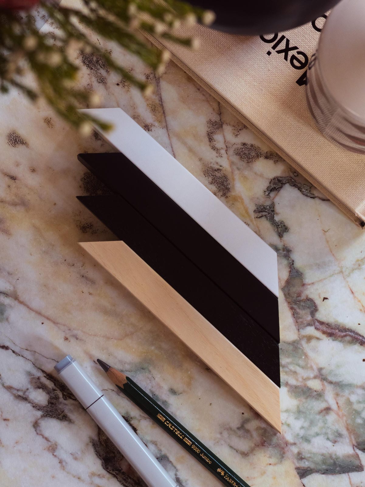 30" x 40" - Premium Wooden Picture Frame samples in white, black, and natural wood on marble surface