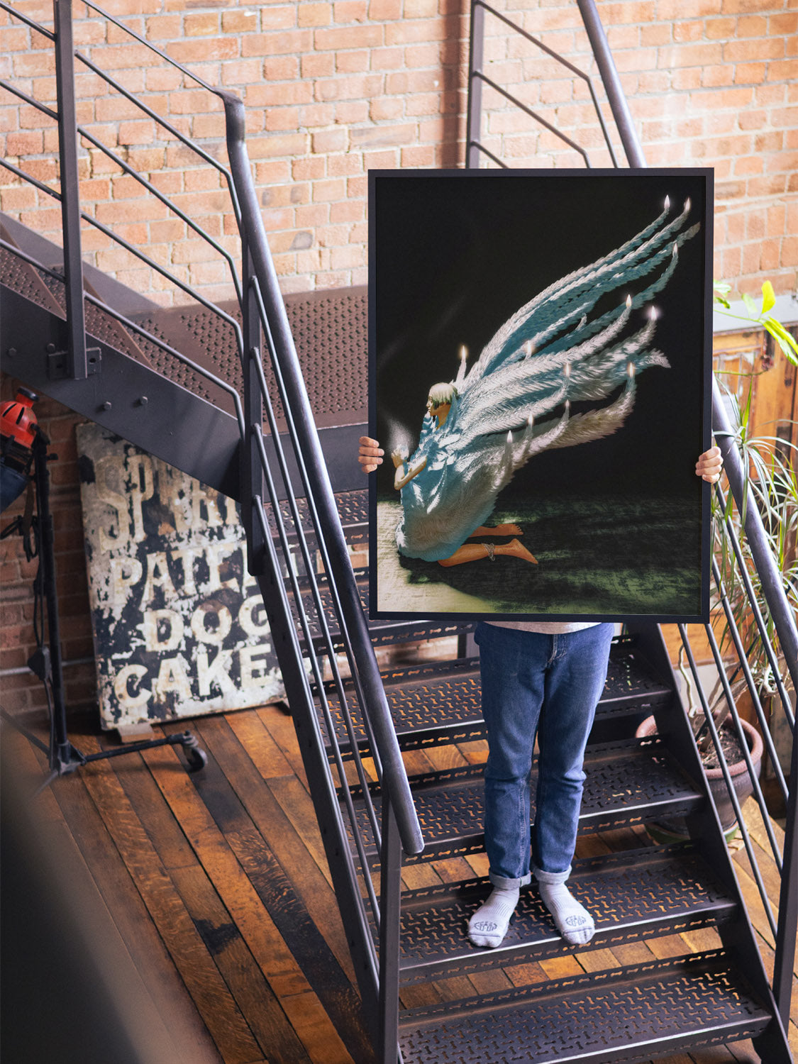 "Playing God" by Denisa Rahma displayed in styled interior, fine art print in black frame.