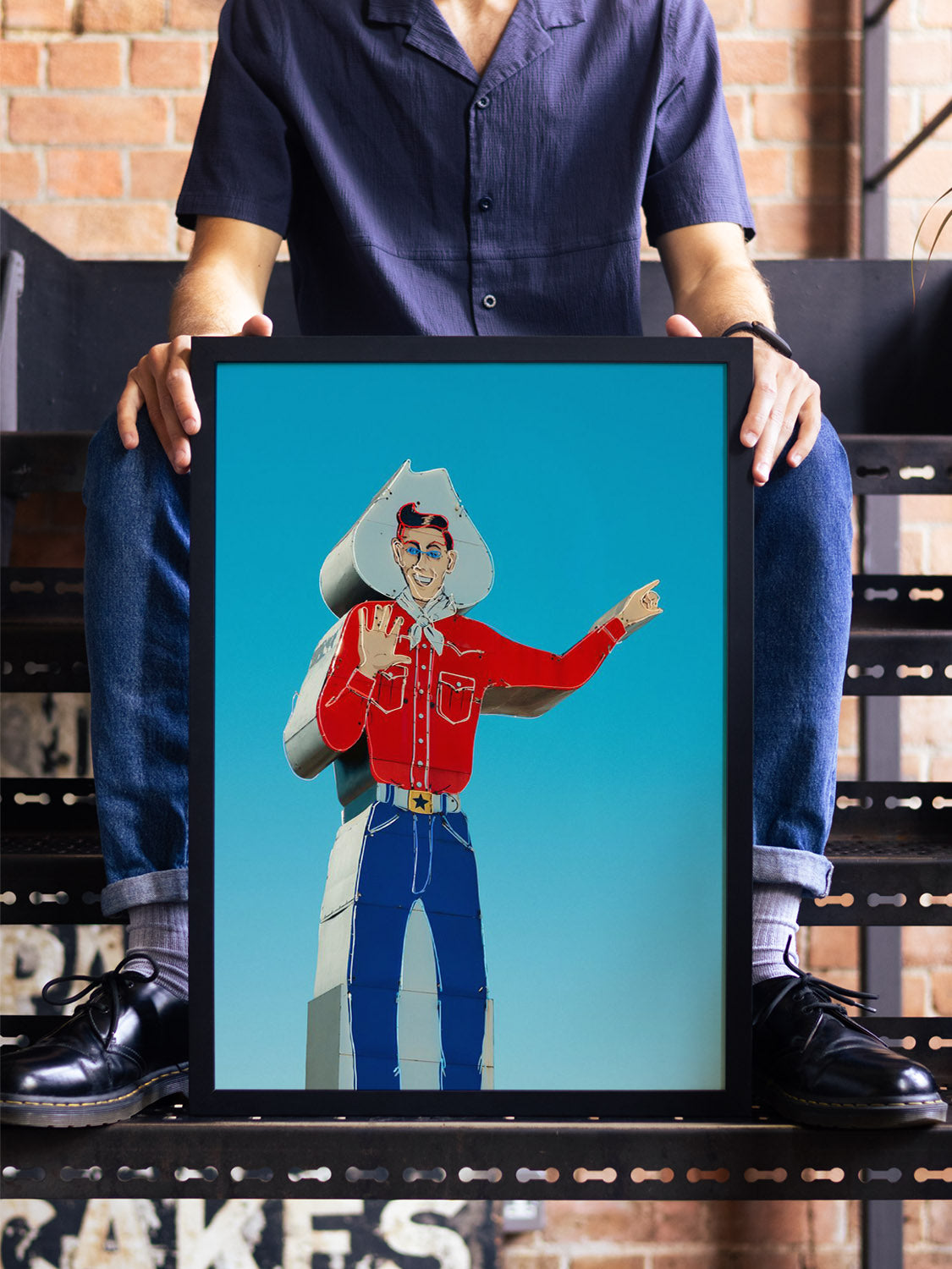 "Head West, Texas" by Philip Jobling in black frame, displayed in styled interior, fine art print.