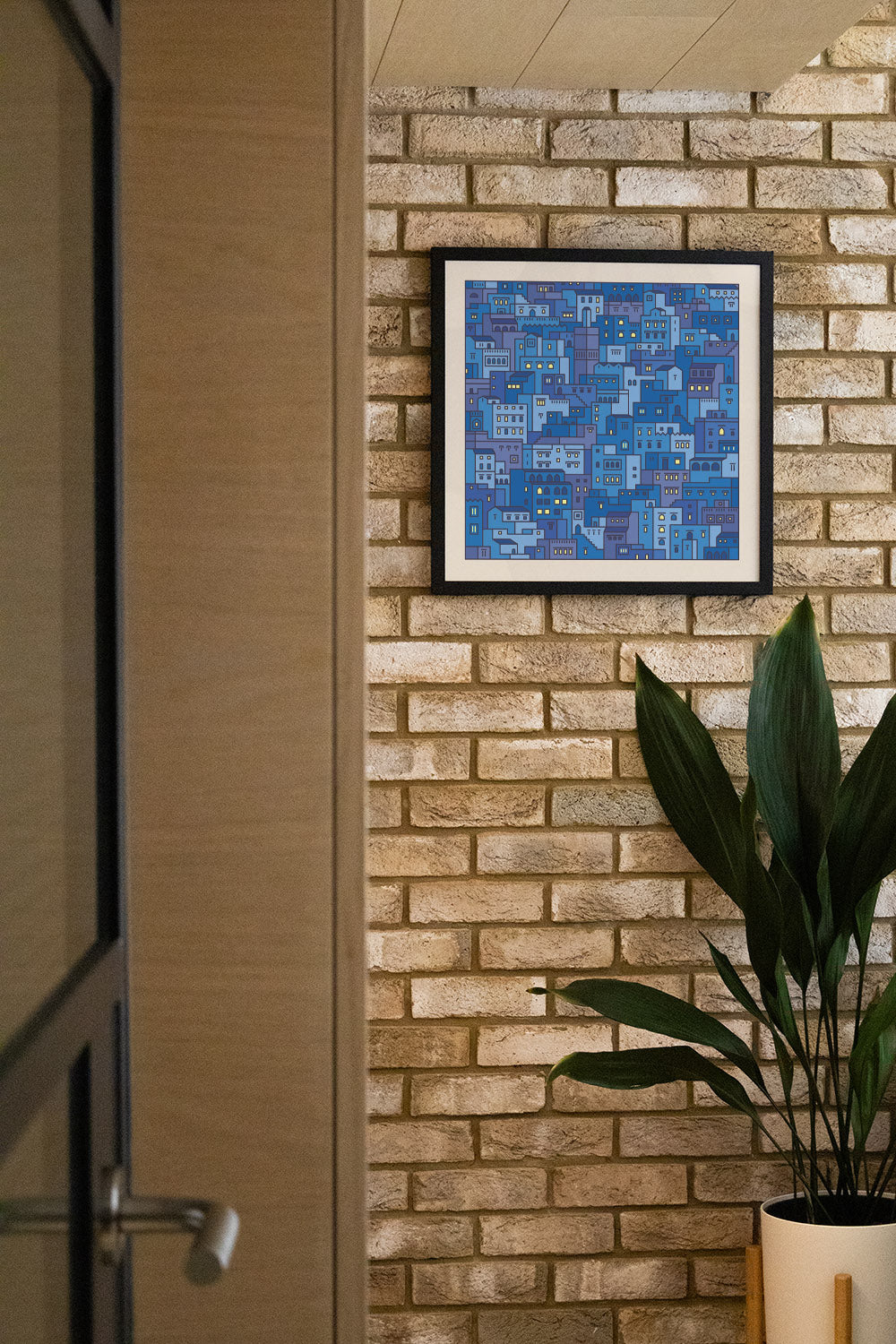 "Settlements 04 – Chefchaouen, Morocco by Rick Crane in black frame, displayed in a styled interior setting" |type=lifestyle|