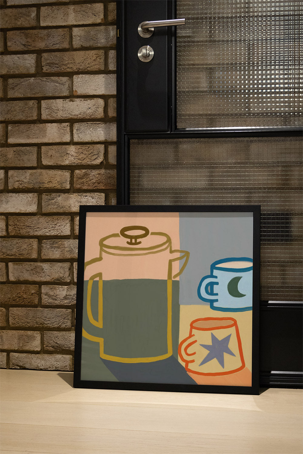 "Moon & Stars Coffee by Sophia Sky, in black frame, displayed in a contemporary interior setting." |type=lifestyle|